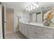 Bright bathroom with a marble countertop vanity, neutral wall color and decorative vase at 5125 Winding Brook Rd, Charlotte, NC 28226