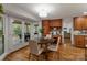 Bright breakfast nook with hardwood floors and access to a patio at 5125 Winding Brook Rd, Charlotte, NC 28226