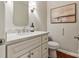 Stylish half bathroom featuring modern vanity, mirror, and elegant decor at 5125 Winding Brook Rd, Charlotte, NC 28226