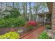 Beautifully landscaped backyard with flowering shrubs and manicured gardens at 5125 Winding Brook Rd, Charlotte, NC 28226