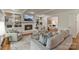 Open-concept living room featuring fireplace, built-in shelves, and hardwood floors at 5125 Winding Brook Rd, Charlotte, NC 28226