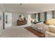 Expansive main bedroom features a sitting area, large windows and ensuite bathroom at 5125 Winding Brook Rd, Charlotte, NC 28226