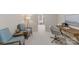 Cozy home office with seating and a desk provides a quiet workspace at 5125 Winding Brook Rd, Charlotte, NC 28226