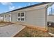Backyard featuring a concrete patio, well-maintained siding, and a view of the surrounding landscape at 5407 Windy Valley Dr, Charlotte, NC 28208