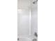 Clean bathroom featuring a tub, shower, white textured tile, and stainless steel fixtures at 5407 Windy Valley Dr, Charlotte, NC 28208