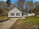 Charming single-story home featuring a well-manicured lawn, concrete driveway, and classic curb appeal at 5407 Windy Valley Dr, Charlotte, NC 28208