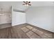 Empty Living Room featuring light wood flooring, a vaulted ceiling and neutral walls ready to be customized at 5407 Windy Valley Dr, Charlotte, NC 28208