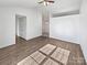 Spacious living room with vaulted ceilings, wood-look floors, and natural light at 5407 Windy Valley Dr, Charlotte, NC 28208
