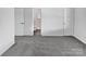 A well-lit main bedroom with neutral walls and carpet leading to an ensuite bathroom for easy access at 5407 Windy Valley Dr, Charlotte, NC 28208