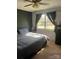 Comfortable bedroom with a gray comforter and natural light at 554 Trexler Ln, Rock Hill, SC 29732