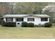 Charming single-story home featuring black shutters, white siding, and a well-maintained front lawn at 554 Trexler Ln, Rock Hill, SC 29732