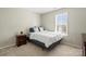 Bedroom featuring neutral walls, carpet, window view, and a globe on a dark wooden nightstand at 5622 Dartington Dr, Indian Land, SC 29707