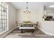 Charming dining area with a modern chandelier and ample natural light, ideal for Gathering meals at 5622 Dartington Dr, Indian Land, SC 29707