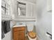 This bathroom features a vanity, toilet, medicine cabinet, and decorative wallpaper at 5876 Wedgewood Dr, Charlotte, NC 28210