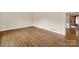 Spacious living room with hardwood floors and neutral walls, offering a blank canvas for personalization at 5876 Wedgewood Dr, Charlotte, NC 28210