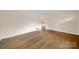 Bright and airy living room with hardwood floors and neutral walls, providing a versatile space for relaxation and entertainment at 5876 Wedgewood Dr, Charlotte, NC 28210