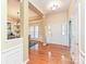 Welcoming foyer with hardwood floors and elegant wainscoting at 6144 Abergele Ln, Matthews, NC 28104
