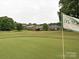 Scenic view of the golf course showcasing manicured greens and beautiful community homes at 6144 Abergele Ln, Matthews, NC 28104