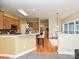 Modern kitchen with breakfast bar, open to the dining area with lots of light at 6144 Abergele Ln, Matthews, NC 28104