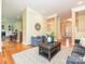 Bright living room with hardwood floors, stylish decor, and open floor plan at 6144 Abergele Ln, Matthews, NC 28104