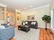 Inviting living room with hardwood floors, neutral paint, plush sofa, and elegant decor at 6144 Abergele Ln, Matthews, NC 28104