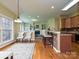 Bright living space with fireplace and seating open to kitchen with breakfast bar at 6144 Abergele Ln, Matthews, NC 28104