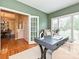 Inviting home office with green walls, a modern desk and shuttered windows at 6144 Abergele Ln, Matthews, NC 28104