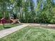 Neighborhood playground with slide, swings, and a book-sharing box at 6144 Abergele Ln, Matthews, NC 28104