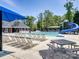 Community pool area with lounge chairs, slide, and picnic tables at 6144 Abergele Ln, Matthews, NC 28104