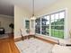 Cozy sun room with large windows offering scenic backyard views at 6144 Abergele Ln, Matthews, NC 28104