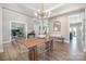 Bright, open dining room with modern light fixture and clear chairs at 6529 Jepson Ct, Charlotte, NC 28214