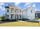Charming two-story home featuring a double front porch, attached garage, and a beautifully landscaped front yard at 6529 Jepson Ct, Charlotte, NC 28214