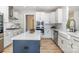 Contemporary kitchen featuring white cabinets, subway tile backsplash, and a stainless steel dishwasher at 6529 Jepson Ct, Charlotte, NC 28214