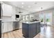 Spacious kitchen island with modern appliances, stylish dining area, and an open layout to the living room at 6529 Jepson Ct, Charlotte, NC 28214