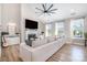 Cozy living room with modern fireplace, stylish furniture, and large windows offering plenty of natural light at 6529 Jepson Ct, Charlotte, NC 28214