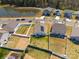 Aerial view showcasing properties with fenced backyards, landscaping, and proximity to a pond at 6816 Pennyroyal Way, Charlotte, NC 28216