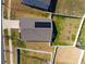 Aerial perspective showcasing the roof of a home and the private, fenced backyard at 6816 Pennyroyal Way, Charlotte, NC 28216