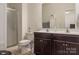 Bathroom featuring double sink vanity, framed mirror, and glass-enclosed shower at 6816 Pennyroyal Way, Charlotte, NC 28216