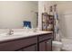 Modern bathroom featuring a double sink vanity, framed mirror, and coordinated shower curtain at 6816 Pennyroyal Way, Charlotte, NC 28216