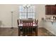 Dining area with a window, a chandelier, and an eight-seat table, perfect for Gathering dinners at 6816 Pennyroyal Way, Charlotte, NC 28216