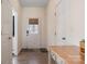 Bright entryway featuring hardwood floors, a decorative front door, and neutral paint at 6816 Pennyroyal Way, Charlotte, NC 28216