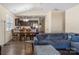 Open-concept living room flows into the dining area and features hardwood floors at 6816 Pennyroyal Way, Charlotte, NC 28216