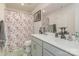 Bright bathroom with a double vanity, shower with floral curtain, and modern fixtures at 715 Saddlebred Ln, Locust, NC 28097
