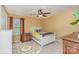 Bedroom with bright yellow walls and plush carpeting offers a cozy space for relaxation and sleep at 715 Saddlebred Ln, Locust, NC 28097
