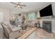 Inviting living room with fireplace, plush sofas, neutral tones, and an open layout at 715 Saddlebred Ln, Locust, NC 28097