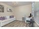 Cozy living room with wood floors, bright natural light, and a modern workspace at 715 Saddlebred Ln, Locust, NC 28097