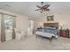 Spacious primary bedroom offers lots of natural light, a tray ceiling, and an ensuite bathroom at 715 Saddlebred Ln, Locust, NC 28097