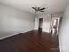 Bright and airy bedroom with hardwood floors, neutral walls, and walk-in closets at 8011 Caliterra Dr, Charlotte, NC 28227