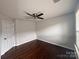 Spacious bedroom with hardwood floors and a ceiling fan at 8011 Caliterra Dr, Charlotte, NC 28227