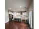 Bright open-concept kitchen with stainless steel appliances, white cabinets, and a center island at 8011 Caliterra Dr, Charlotte, NC 28227